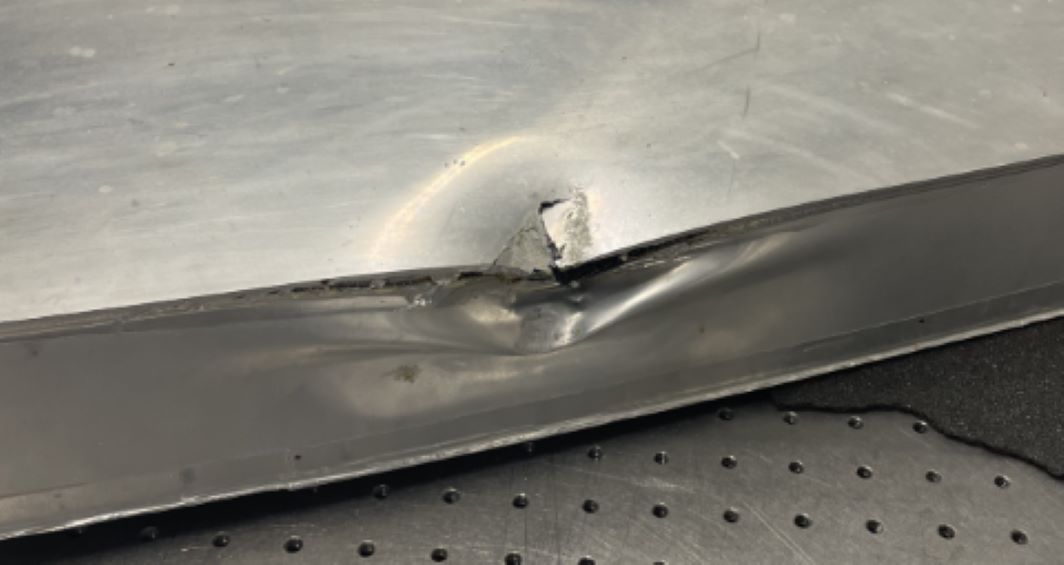 Image of dented composite panel
